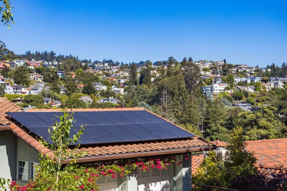 Neighborhood of roofs in Bend, OR after a storm, where every household is running the same claim process